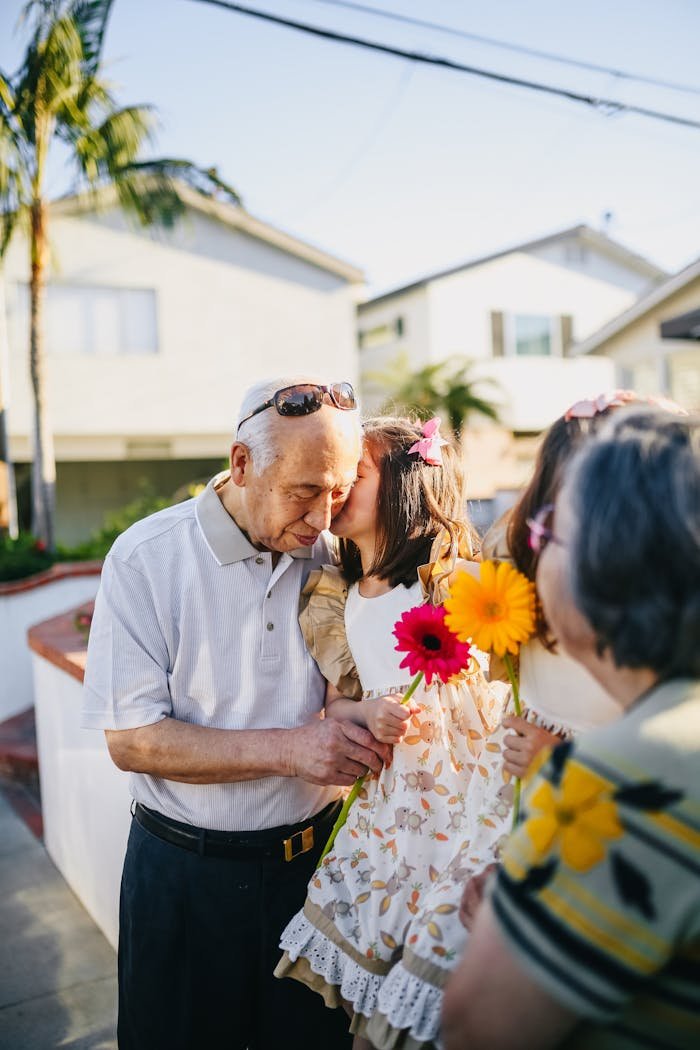 Girls Kissing Their Lovely Grandparents